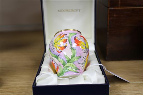 A Moorcroft Enamels miniature vase decorated with stylised fire lilies, boxed, AR initials to base 8cm